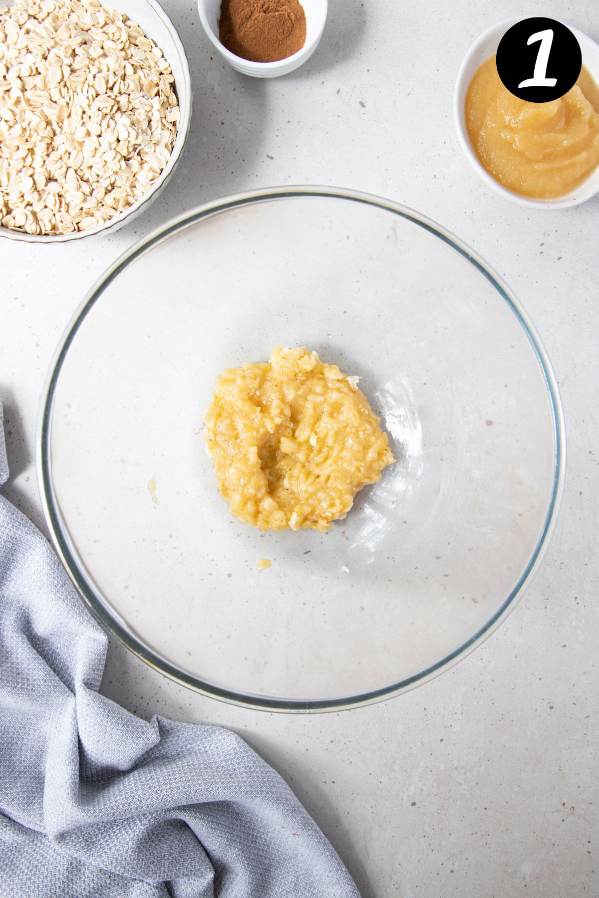 mashed banana in a mixing bowl.