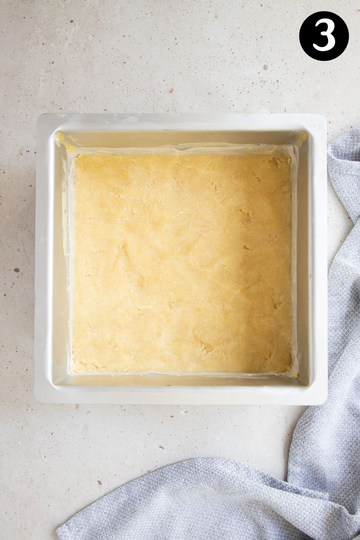 shortbread base pressed into a lined baking tin.