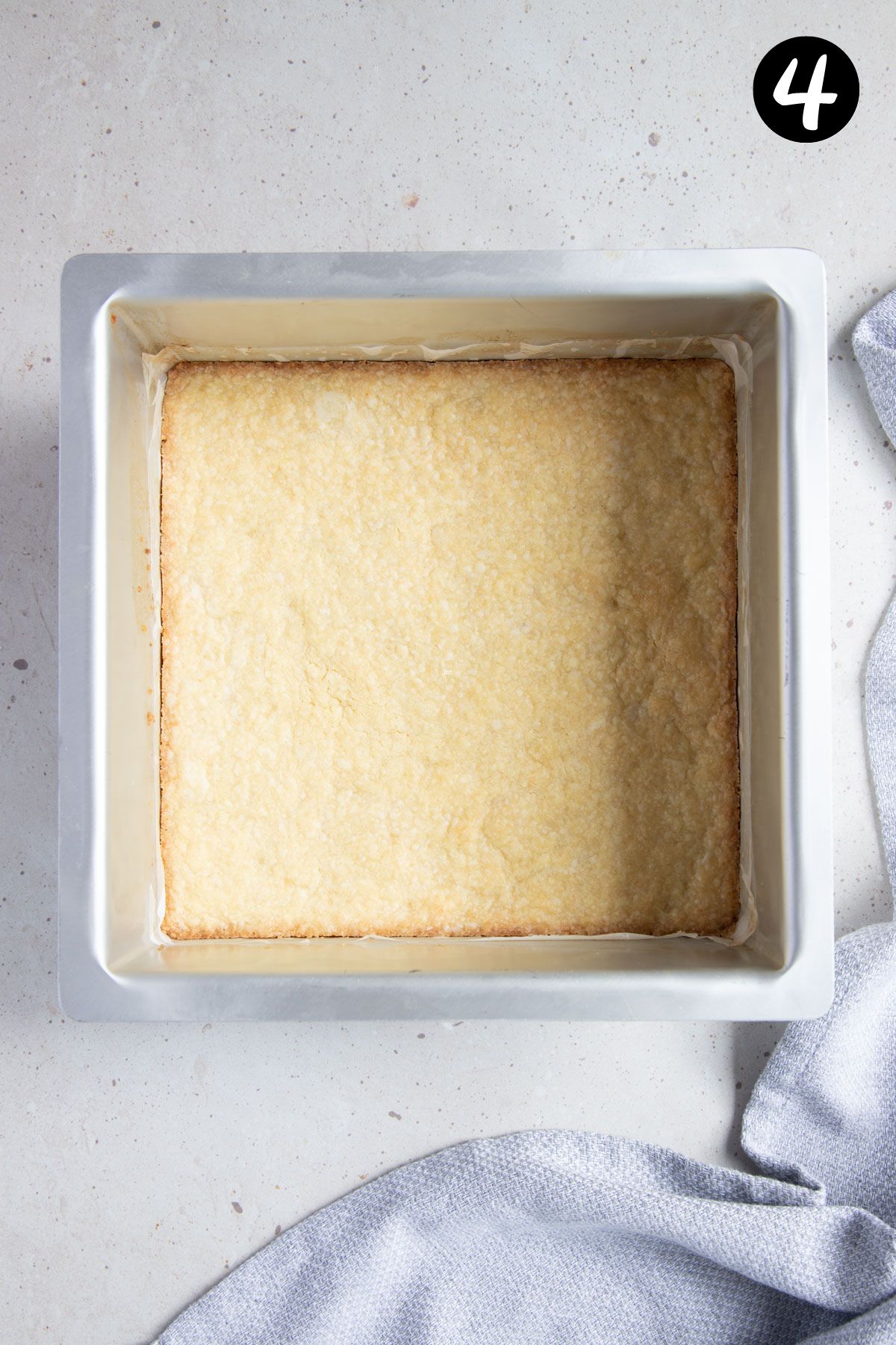 cooked shortbread base in a square tin.