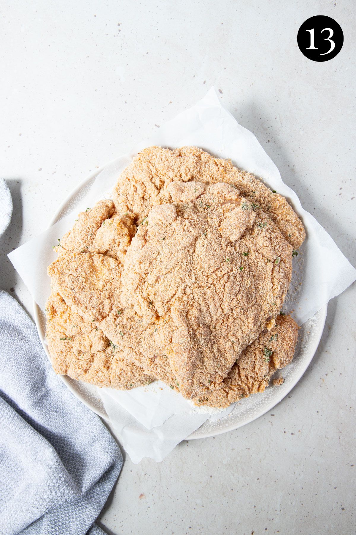 a plate with chicken pieces coated in breadcrumbs.