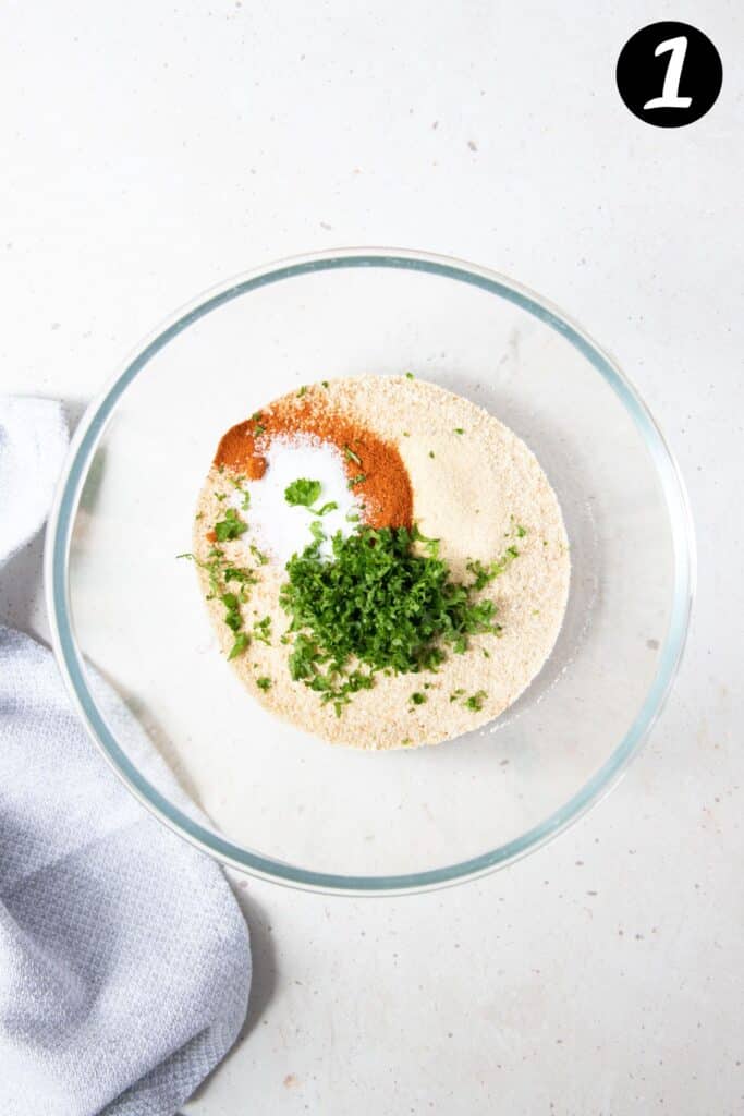 breadcrumbs and coating ingredients together in a bowl.