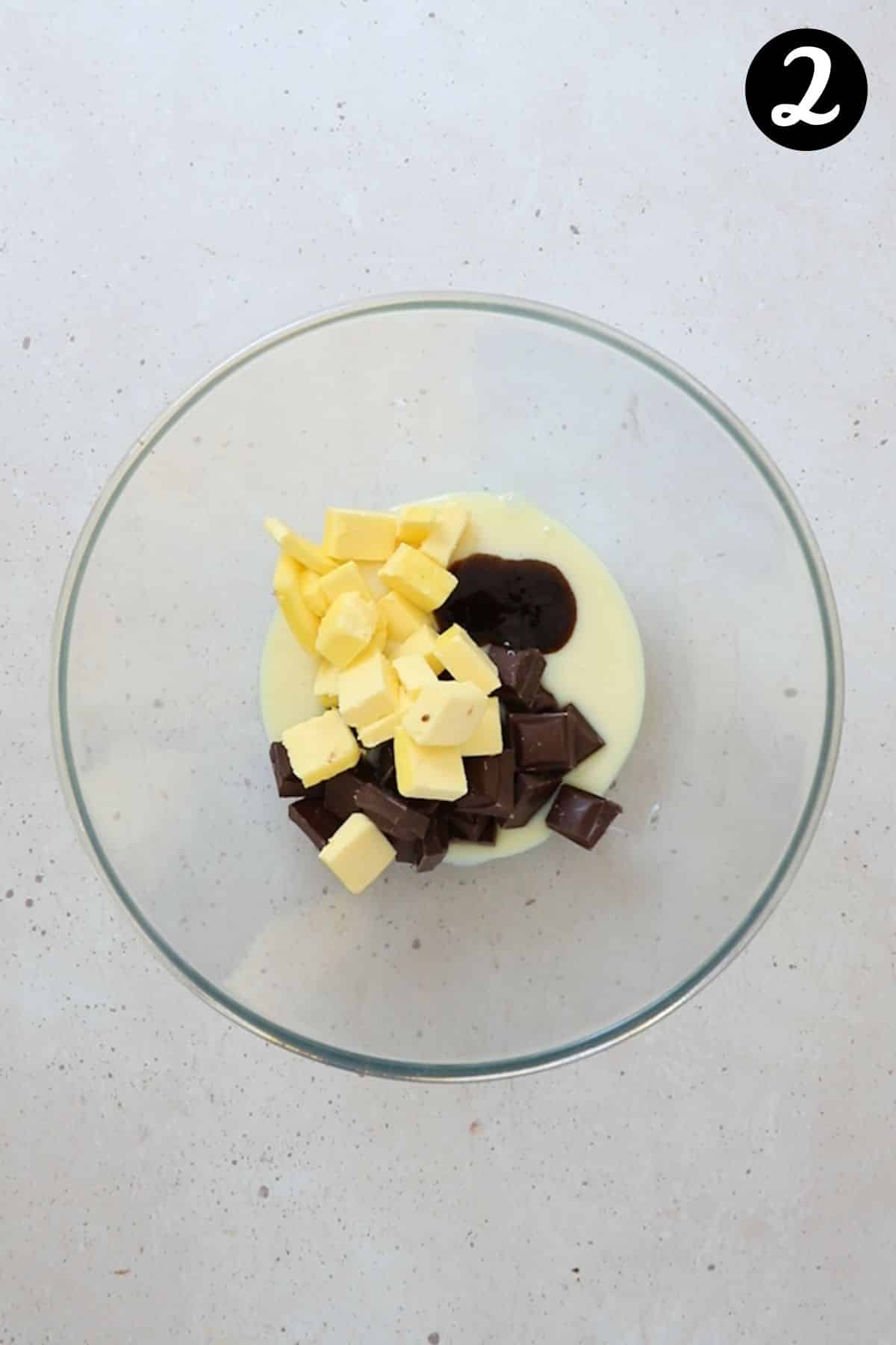 chocolate, butter and condensed milk in a bowl.