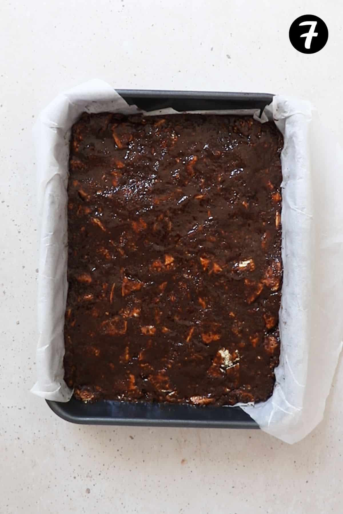 hedgehog slice mixture pressed into a lined tin.