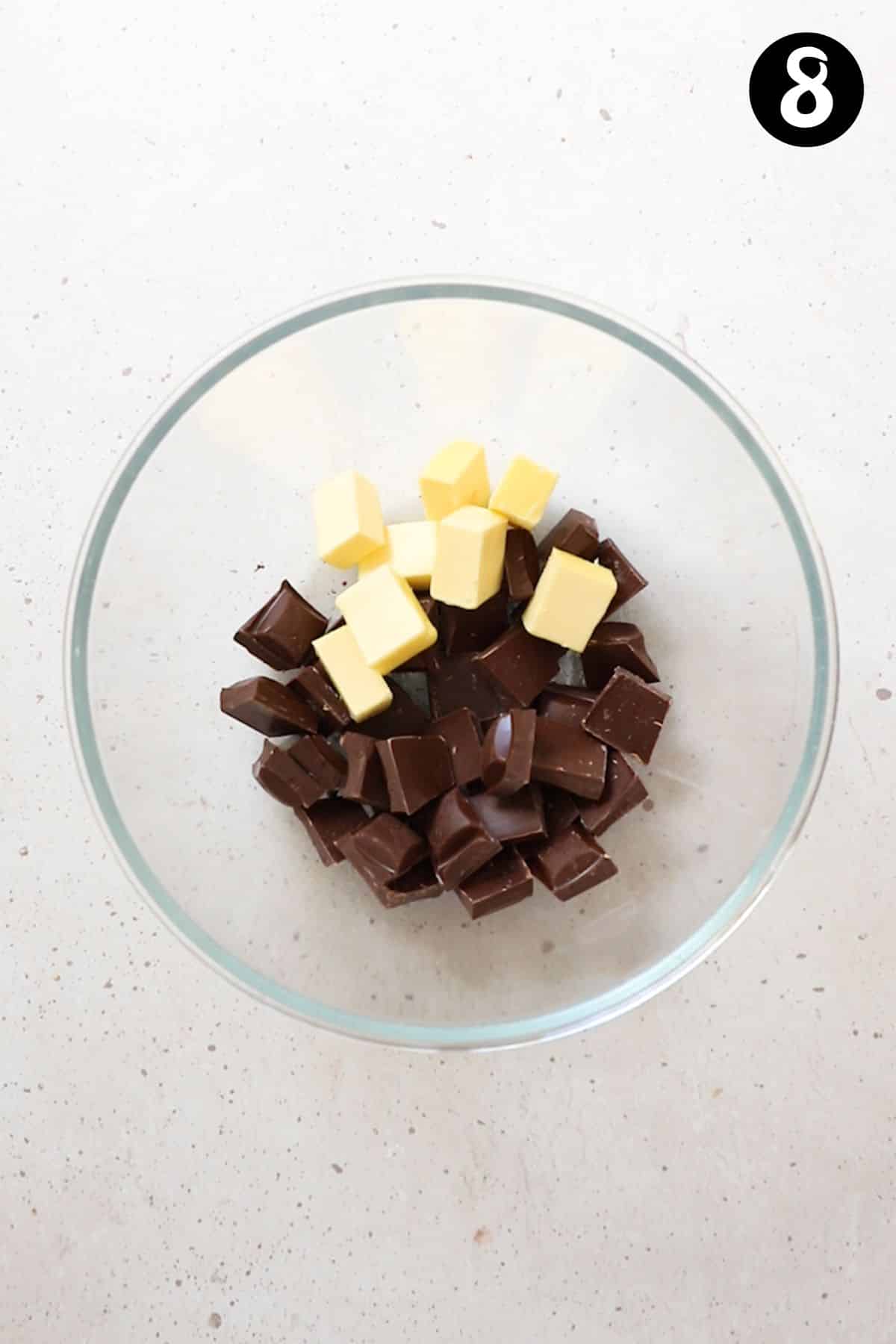 butter and dark chocolate in a glass bowl.