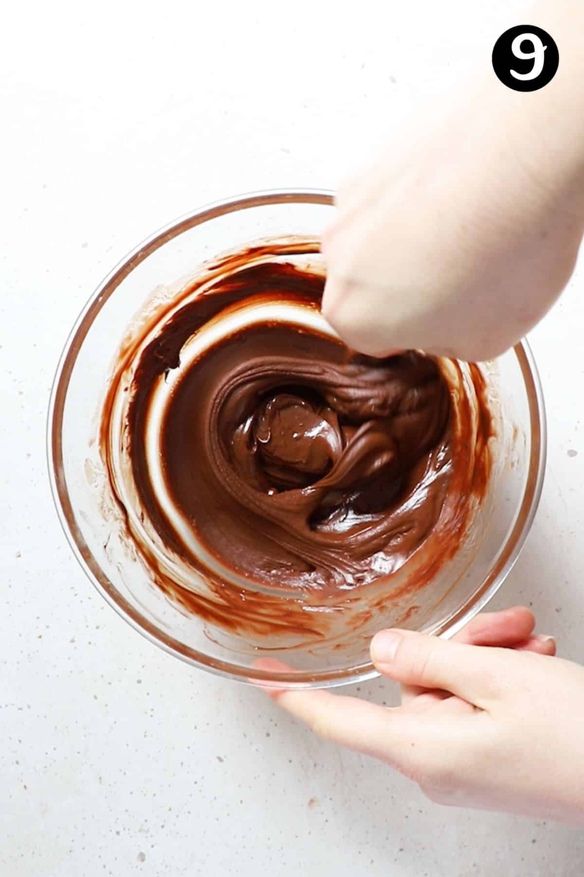 chocolate ganache mixture in a glass bowl.