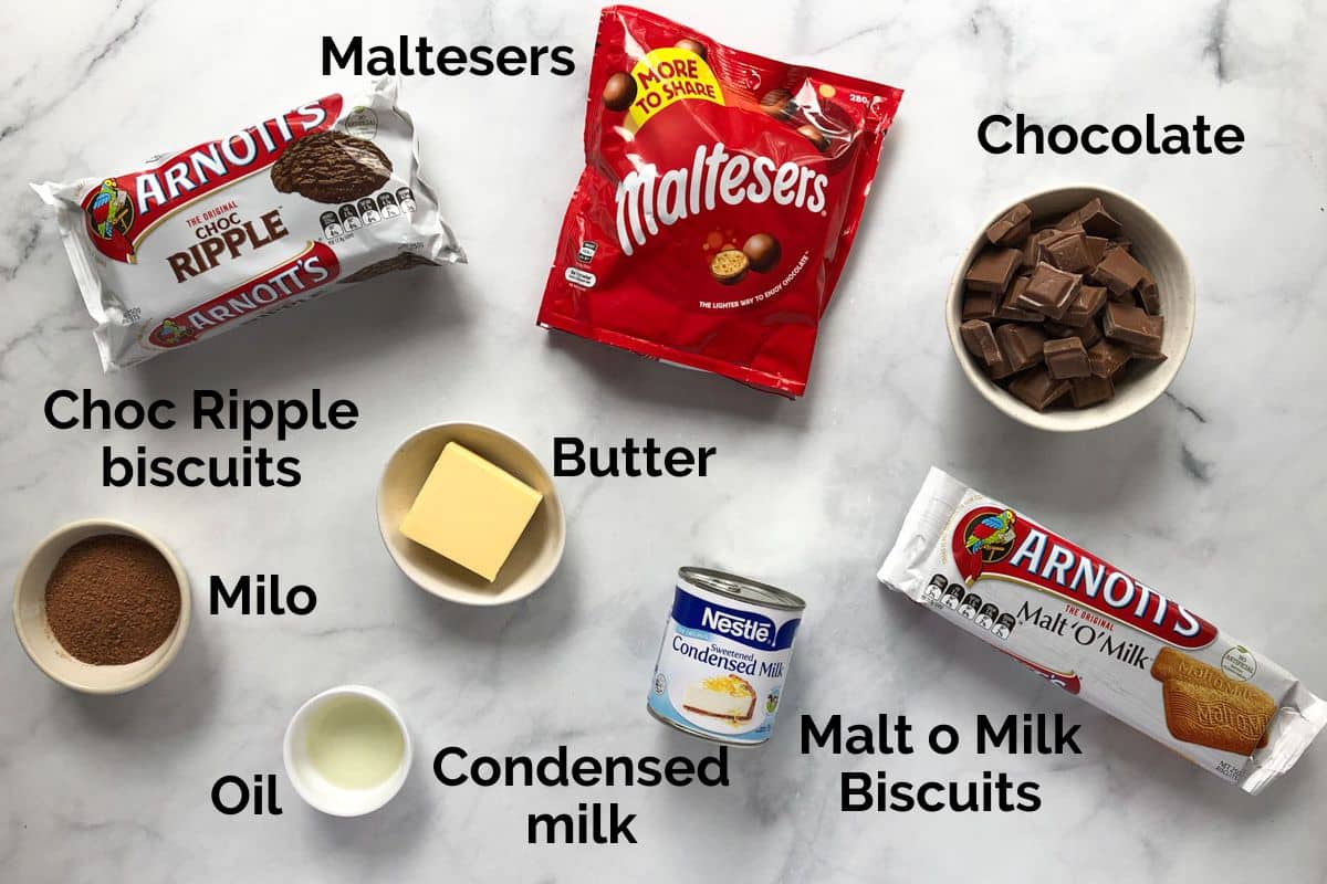 all ingredients for chocolate malteser slice, laid out on a table.