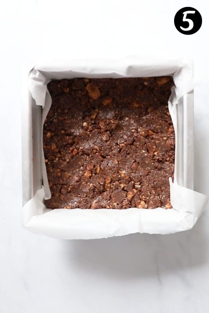 slice mixture pressed into a square tin lined with baking paper.