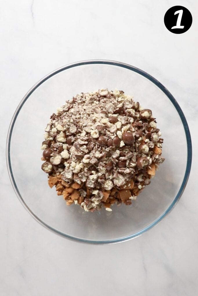 crushed maltesers and biscuits in a glass bowl.