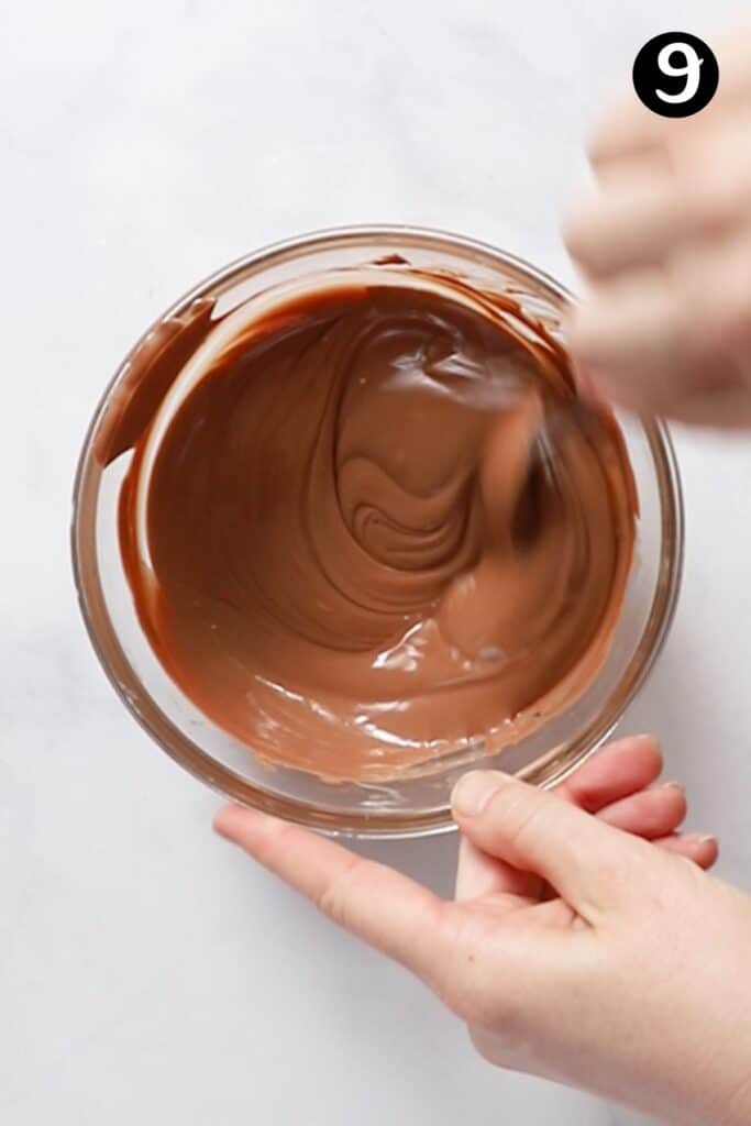 melted chocolate being stirred in a bowl.