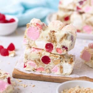 pieces of white chocolate rocky road on a wooden board.