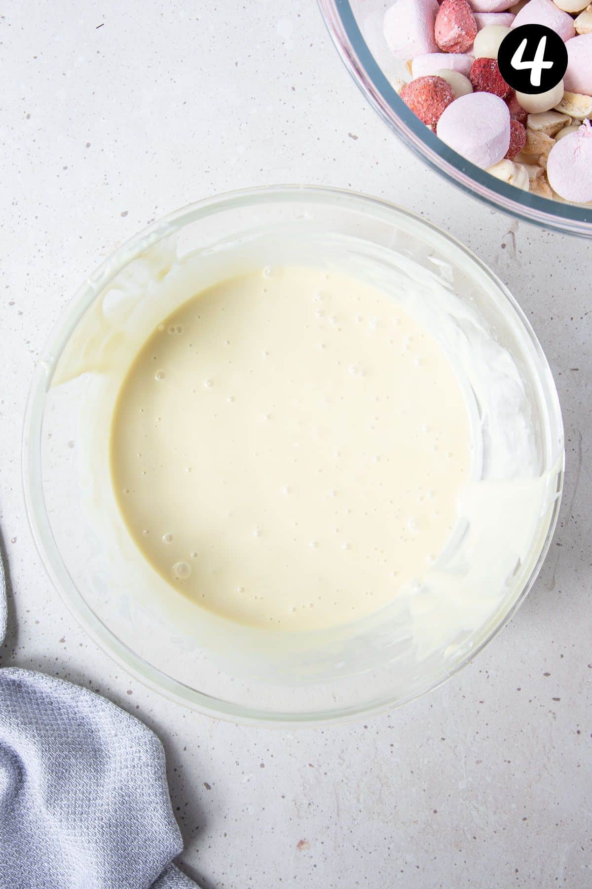 melted white chocolate in a glass bowl.