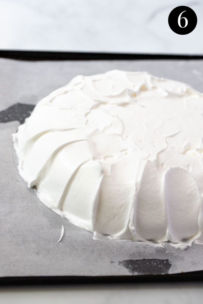 meringue shaped on a lined baking tray.