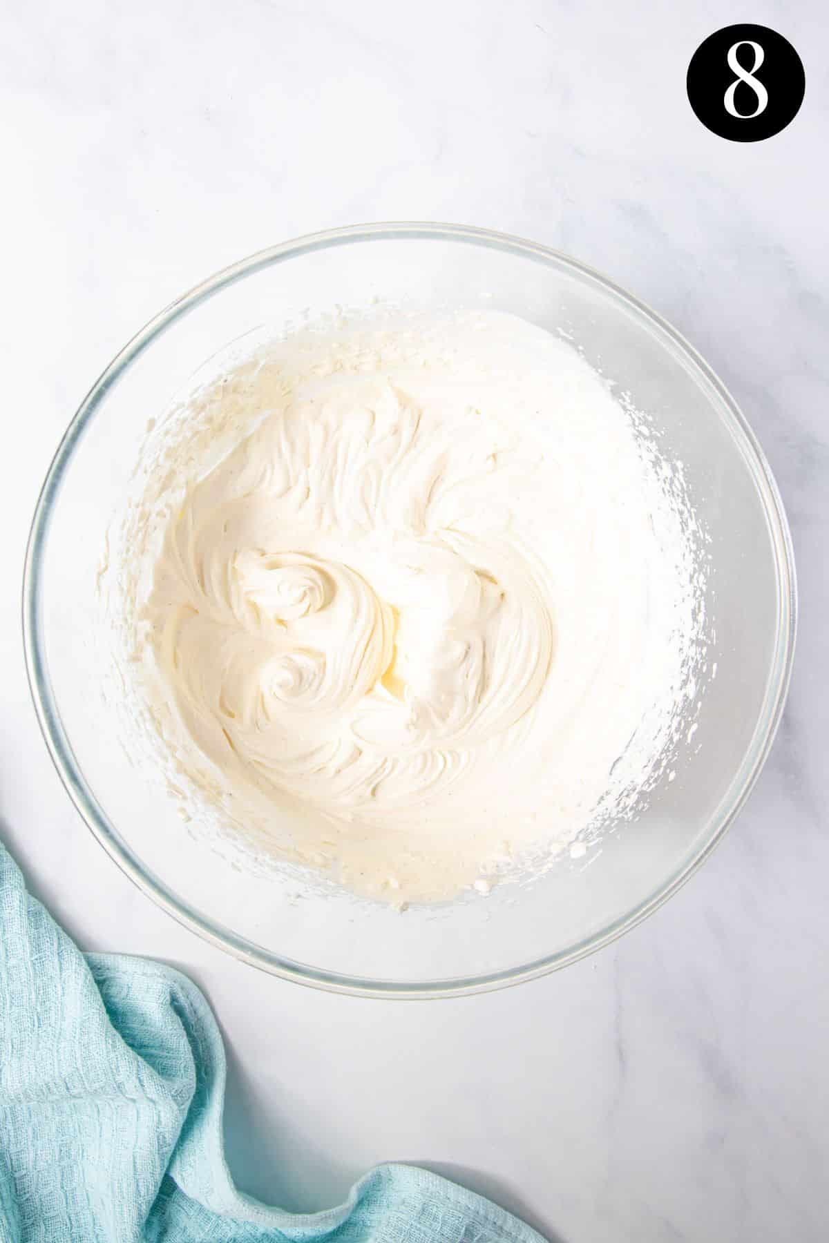 whipped cream in a glass bowl.