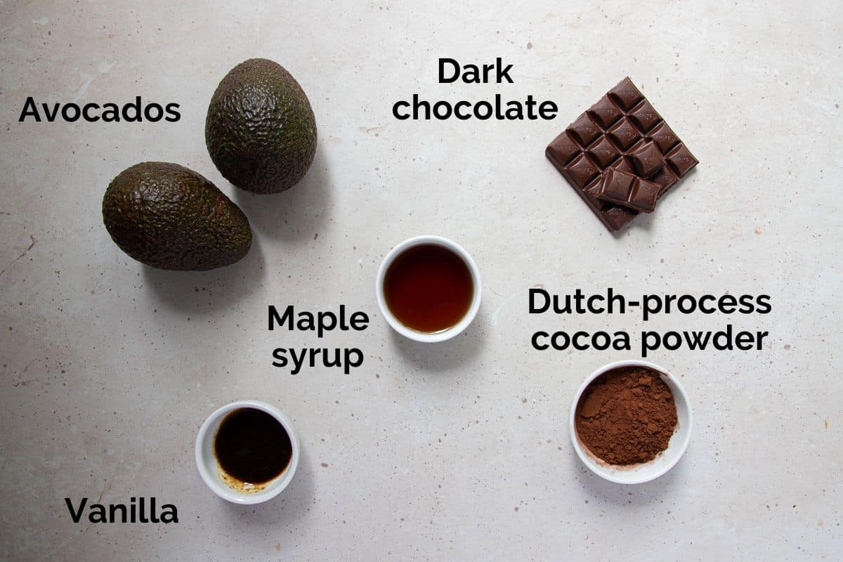 all ingredients for avocado chocolate mousse laid out on a table.