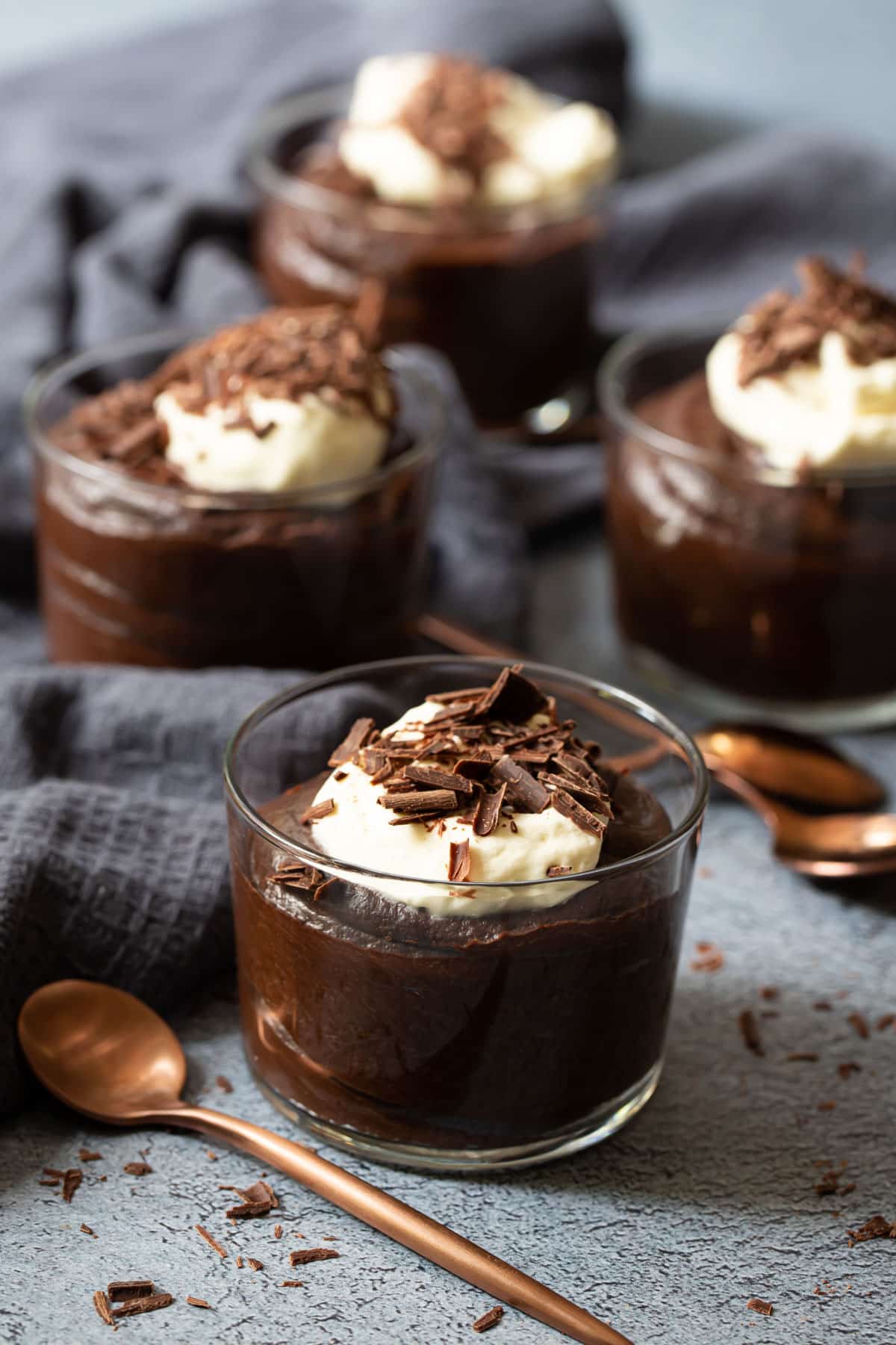 chocolate mousse in individual serves, topped with cream and chocolate.