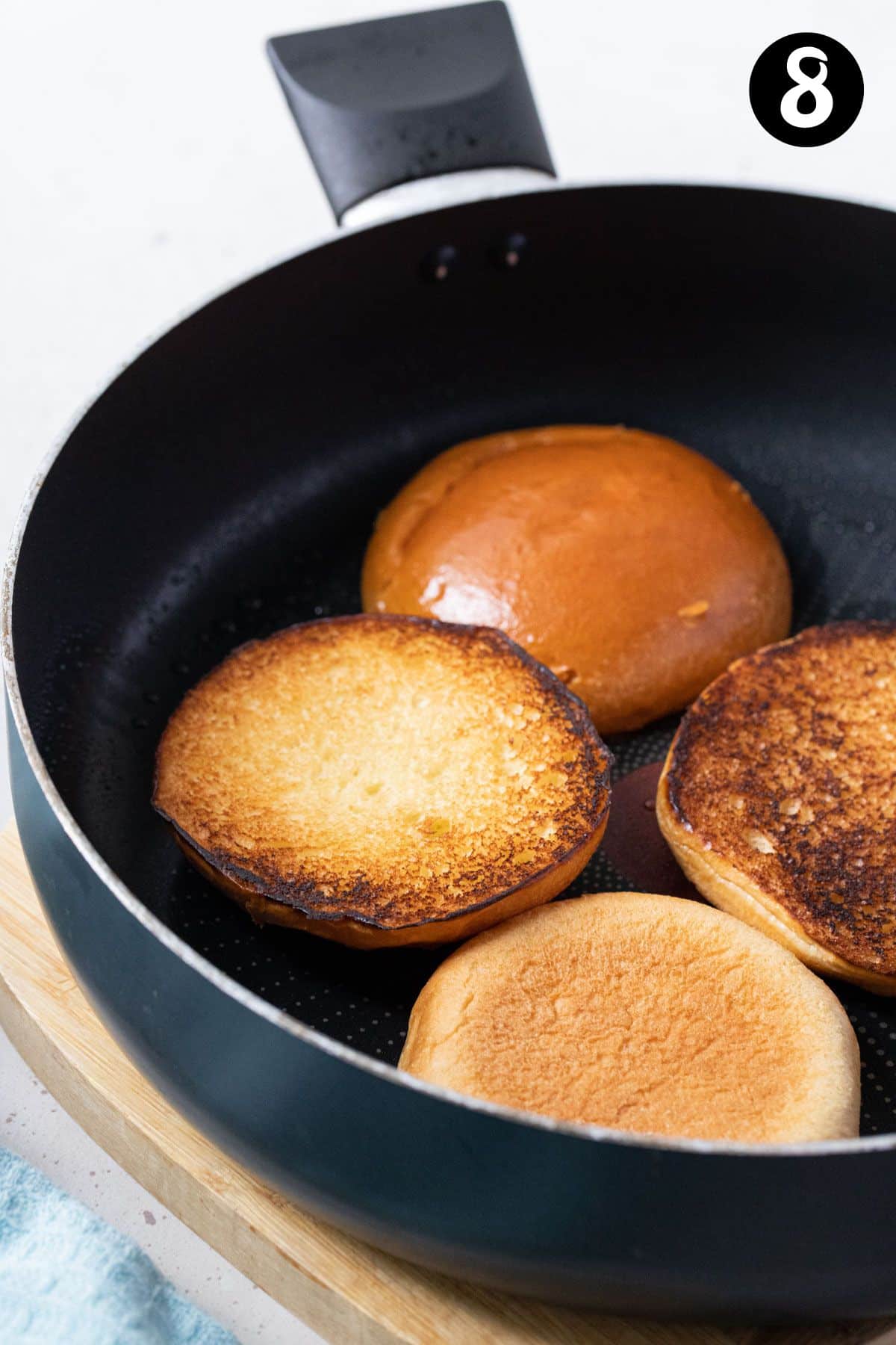 toasted buns in a frying pan.