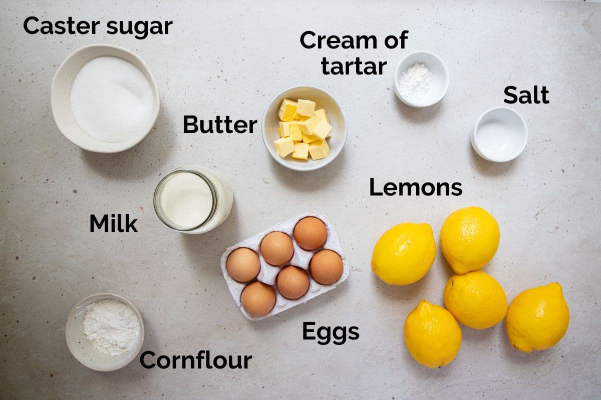 ingredients for lemon meringue pie, laid out on a table.