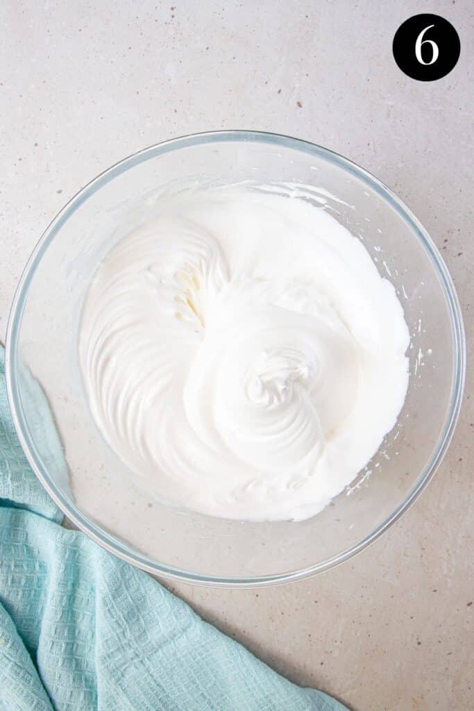 meringue at stiff peak stage in a bowl.