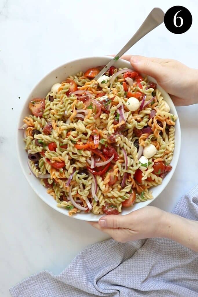 finished pasta salad in a bowl on a table.