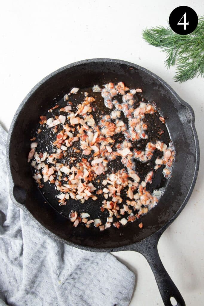 fried bacon pieces in a frying pan.