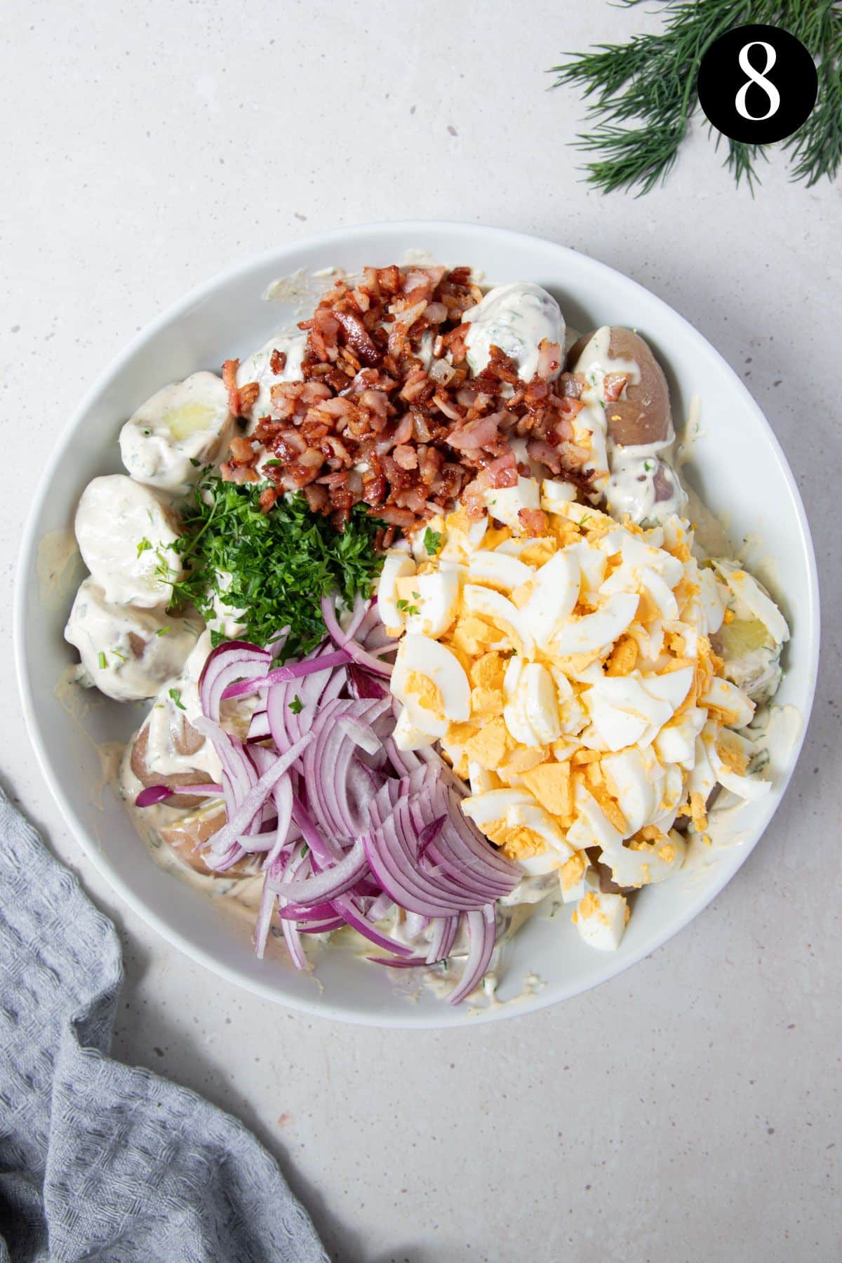 potato salad ingredients together in a bowl.