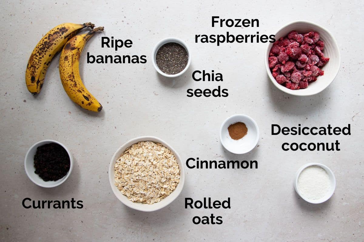 all ingredients for raspberry oatmeal cookies, laid out on a table.