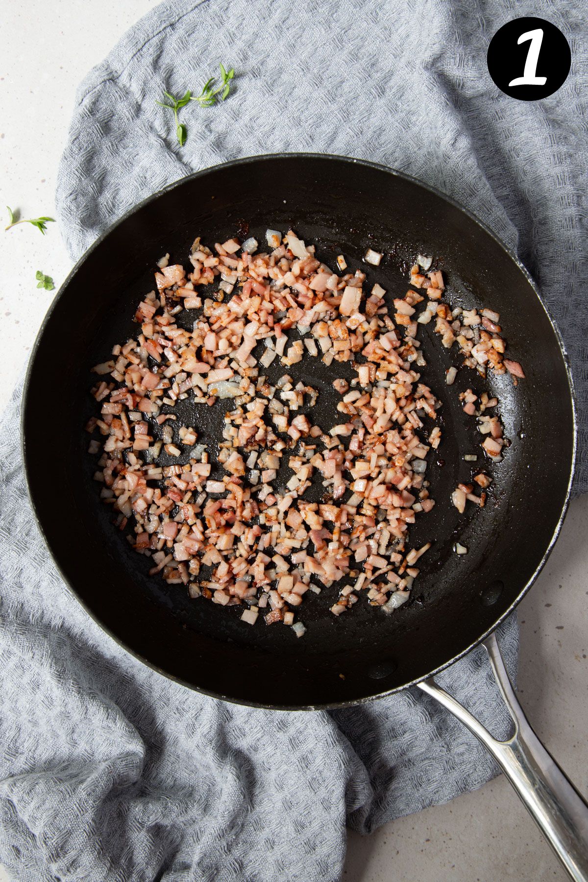 pieces of fried bacon in a pan.