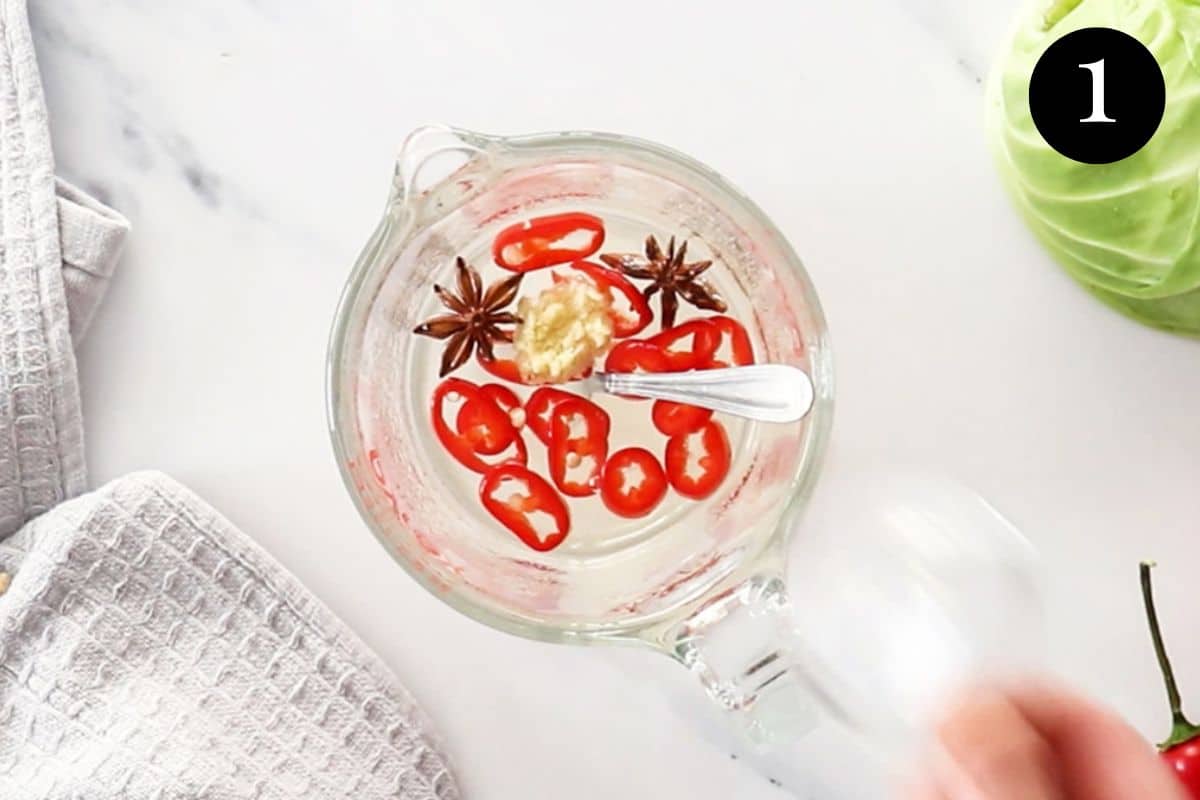 pickling liquid in a jug with star anise and chilli.