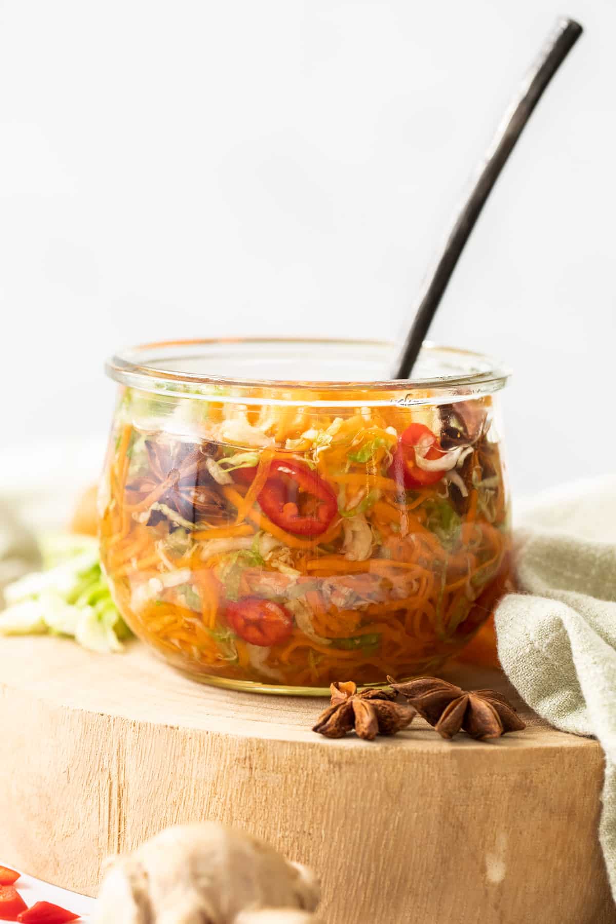 a jar of shredded vegetables in a pickling liquid.