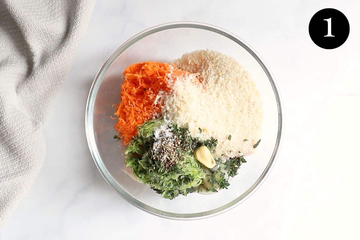 chicken mince and filling ingredients in a glass bowl.