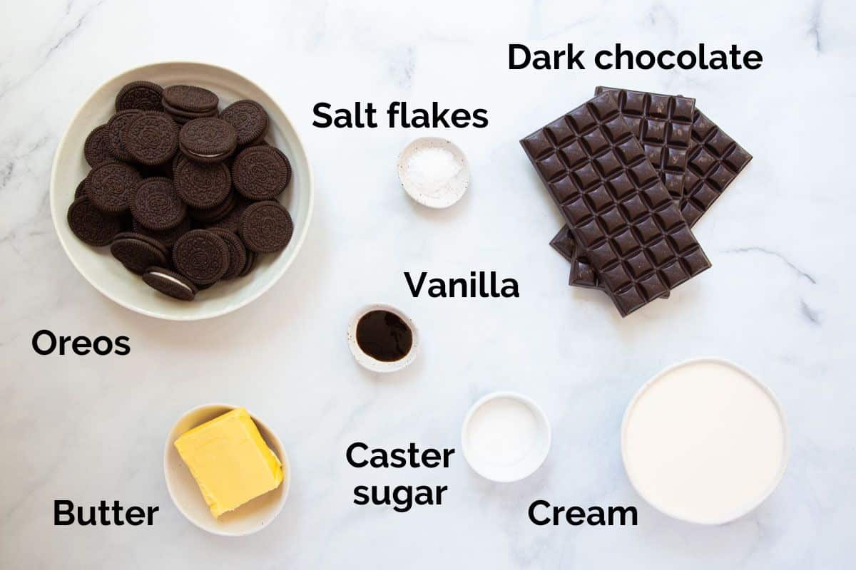 all ingredients for chocolate ganache tart, laid out on a table.