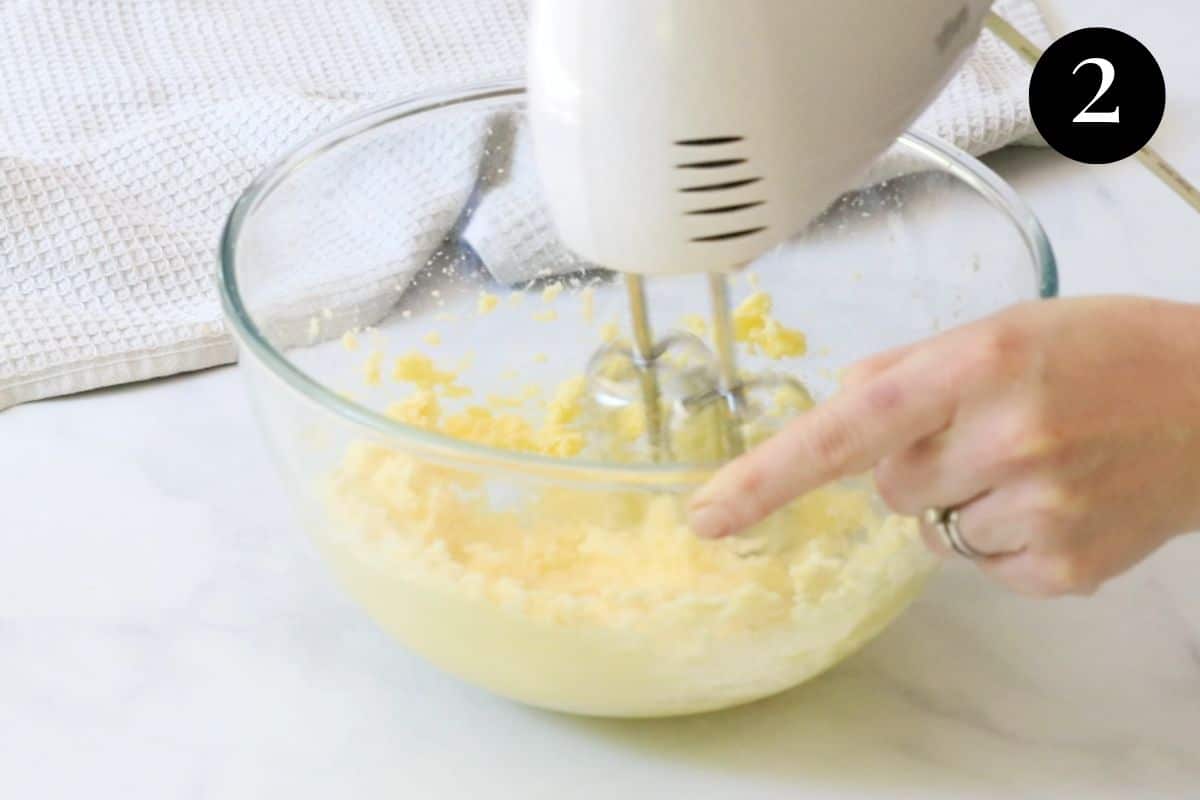 electric beaters creaming butter and sugar in a bowl.
