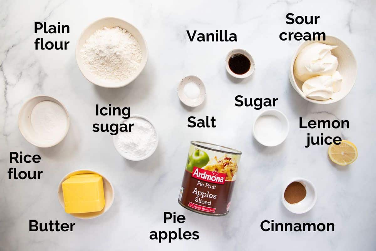 all ingredients for apple sour cream slice, laid out on a table.