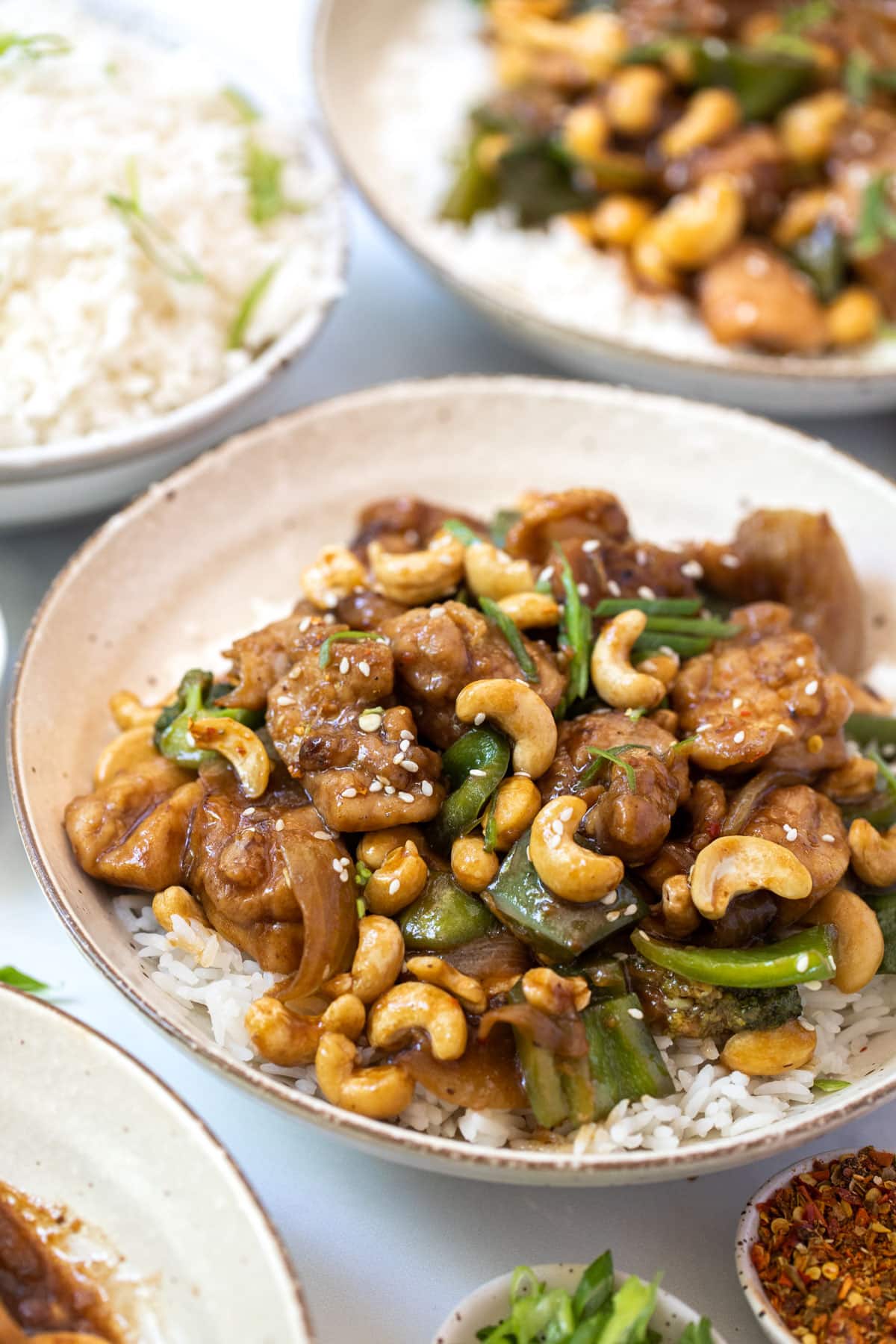 chicken cashew stir fry in a bowl with rice.