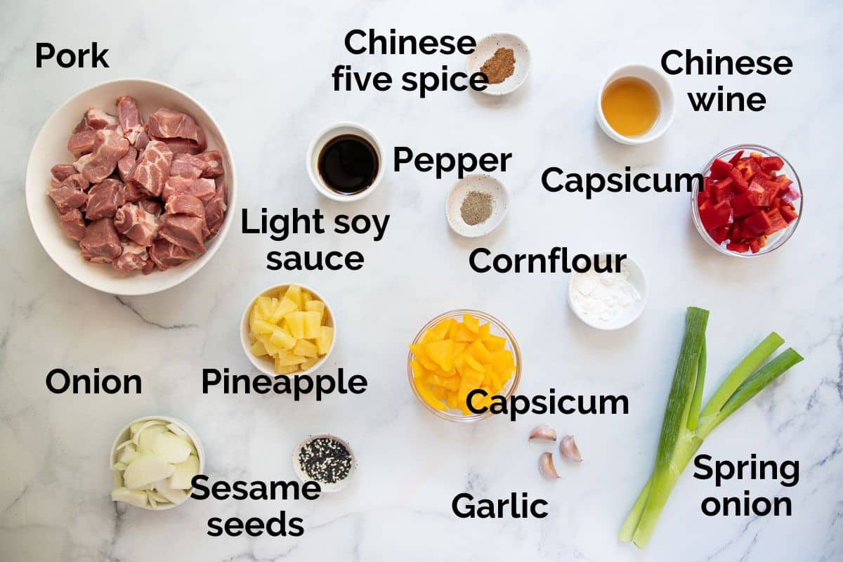 ingredients for sweet and sour pork, laid out on a table.