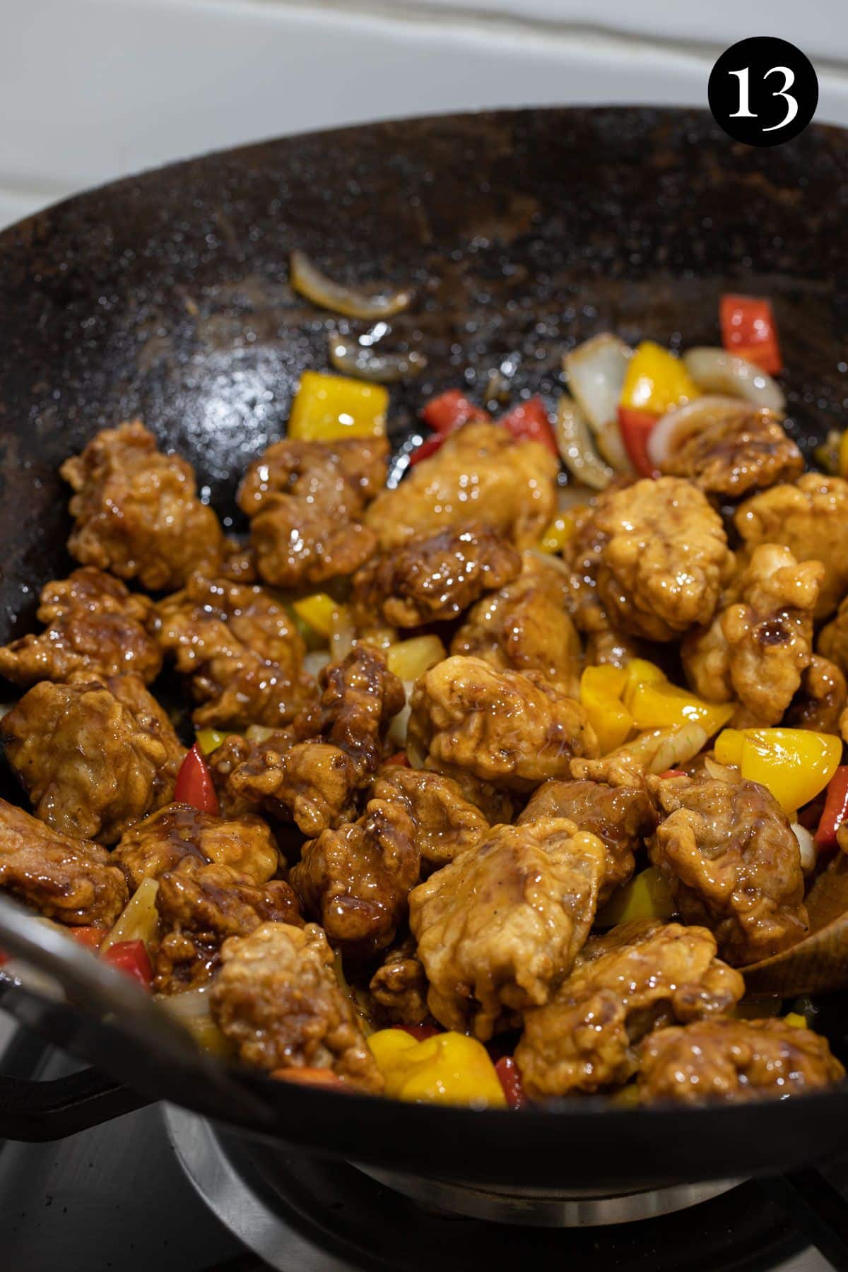 sweet and sour pork in a wok.