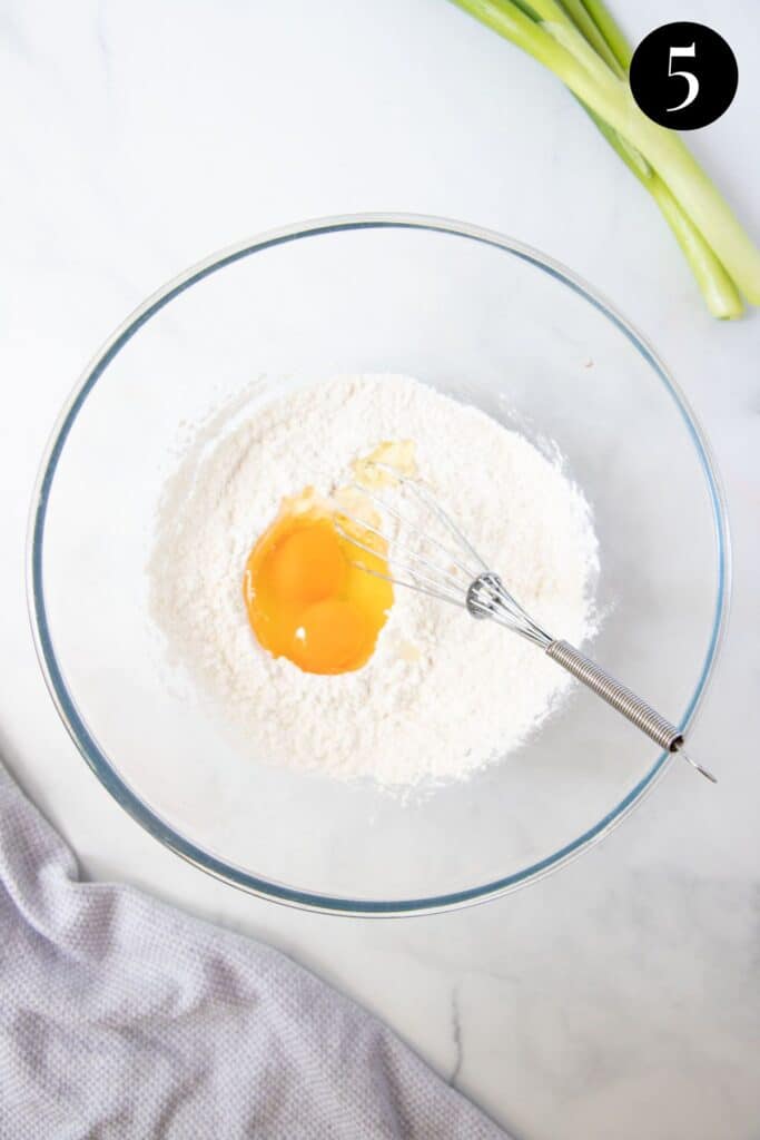eggs and batter ingredients in a bowl.