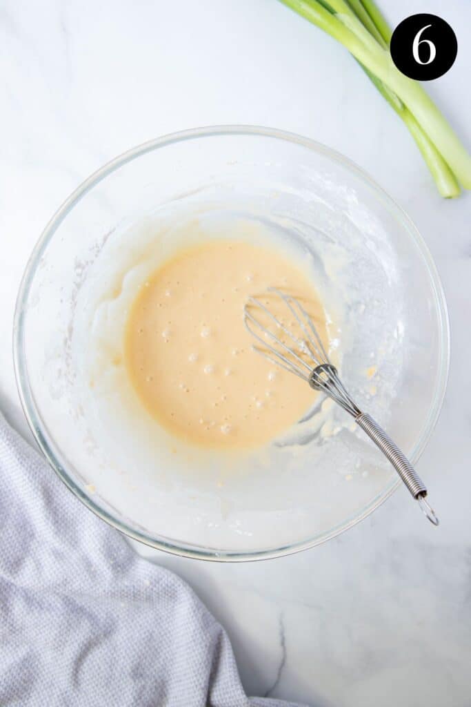 batter in a bowl with a whisk.