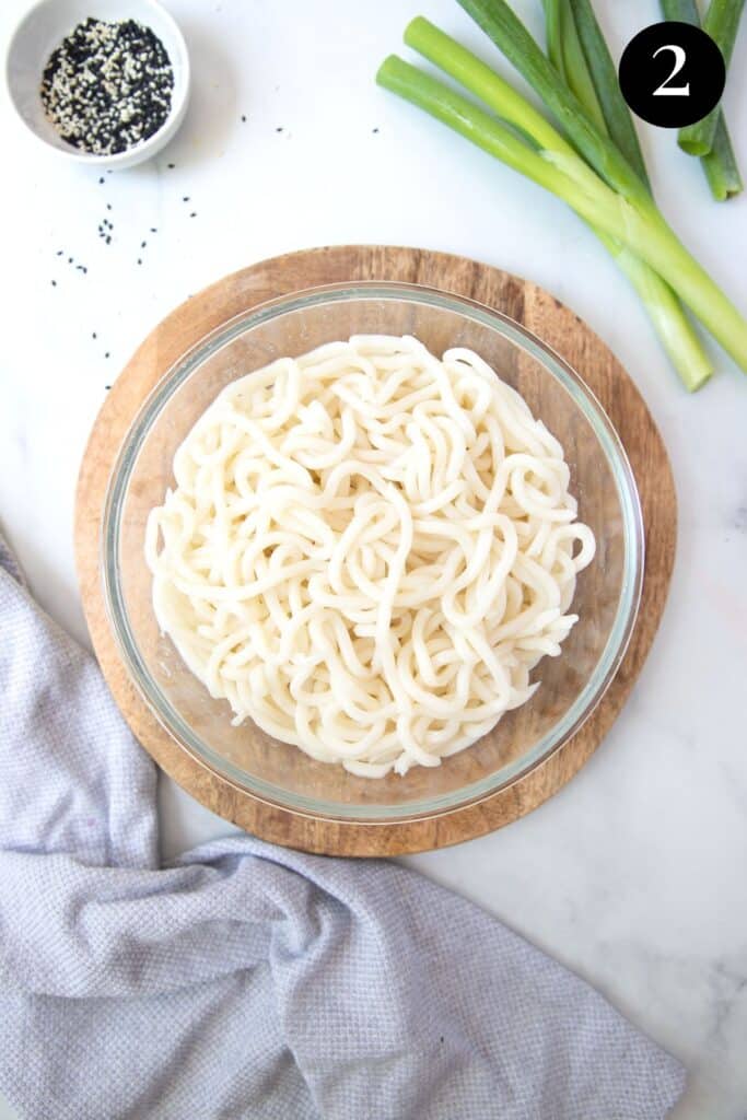 cooked udon noodles in a bowl.
