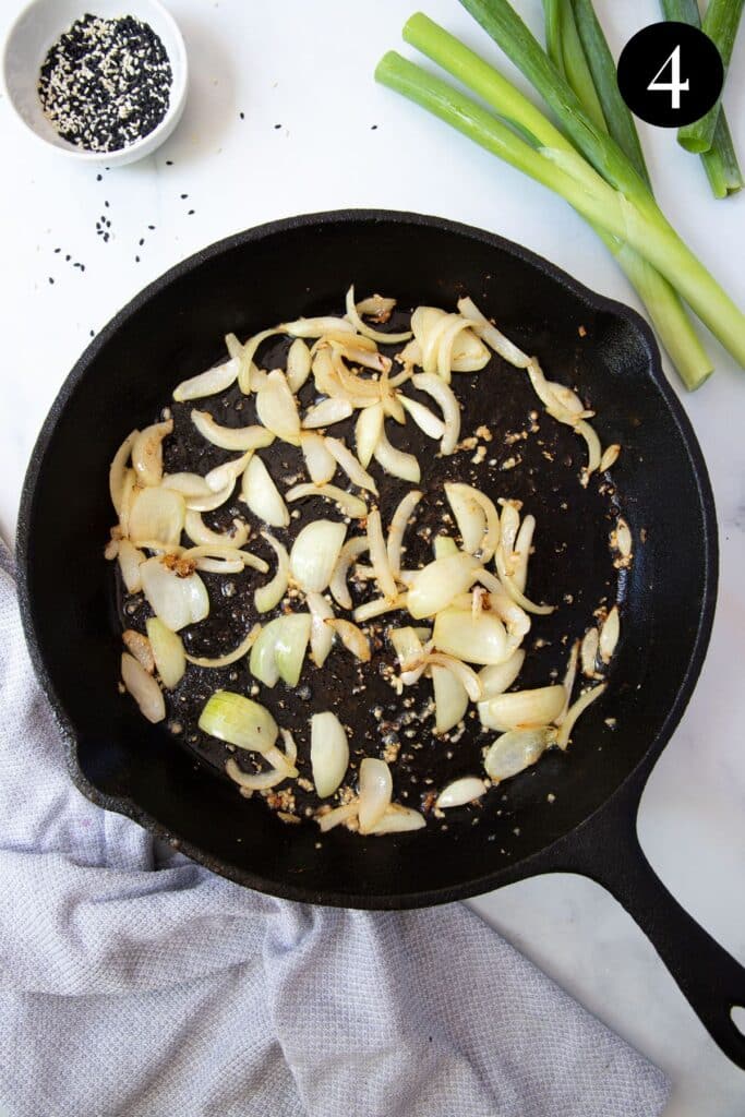 onion and garlic frying in a pan.
