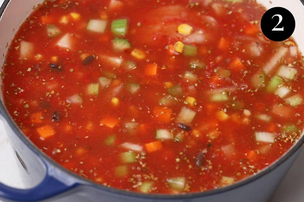 soup ingredients in a pot with vegetables.