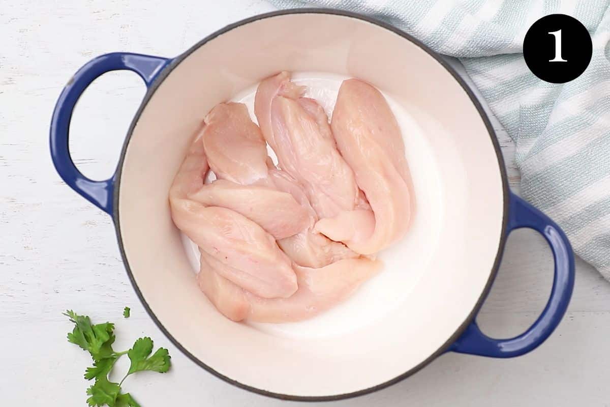 sliced chicken breast in a pot.