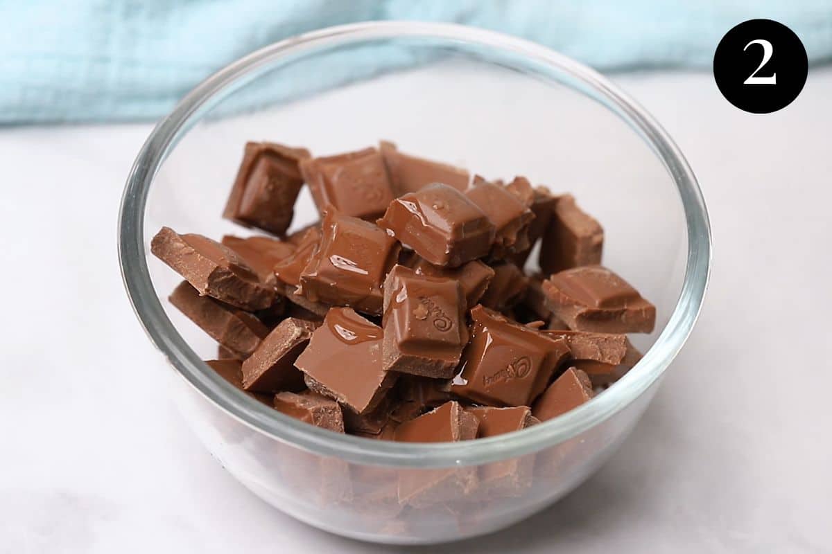 chocolate pieces and oil in a glass bowl.