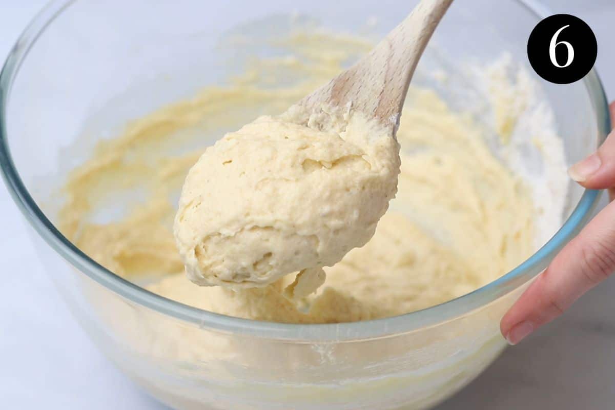 cake batter on a wooden spoon.