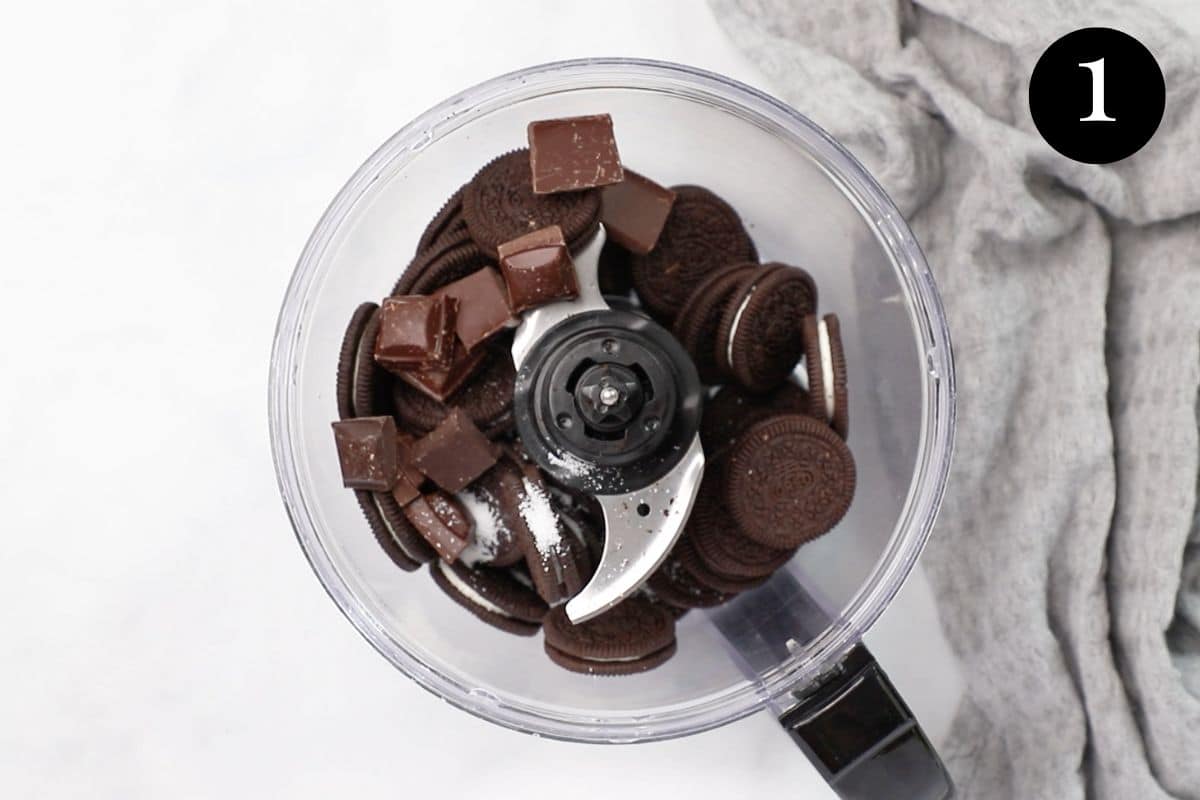 Oreos and chocolate in a food processor.