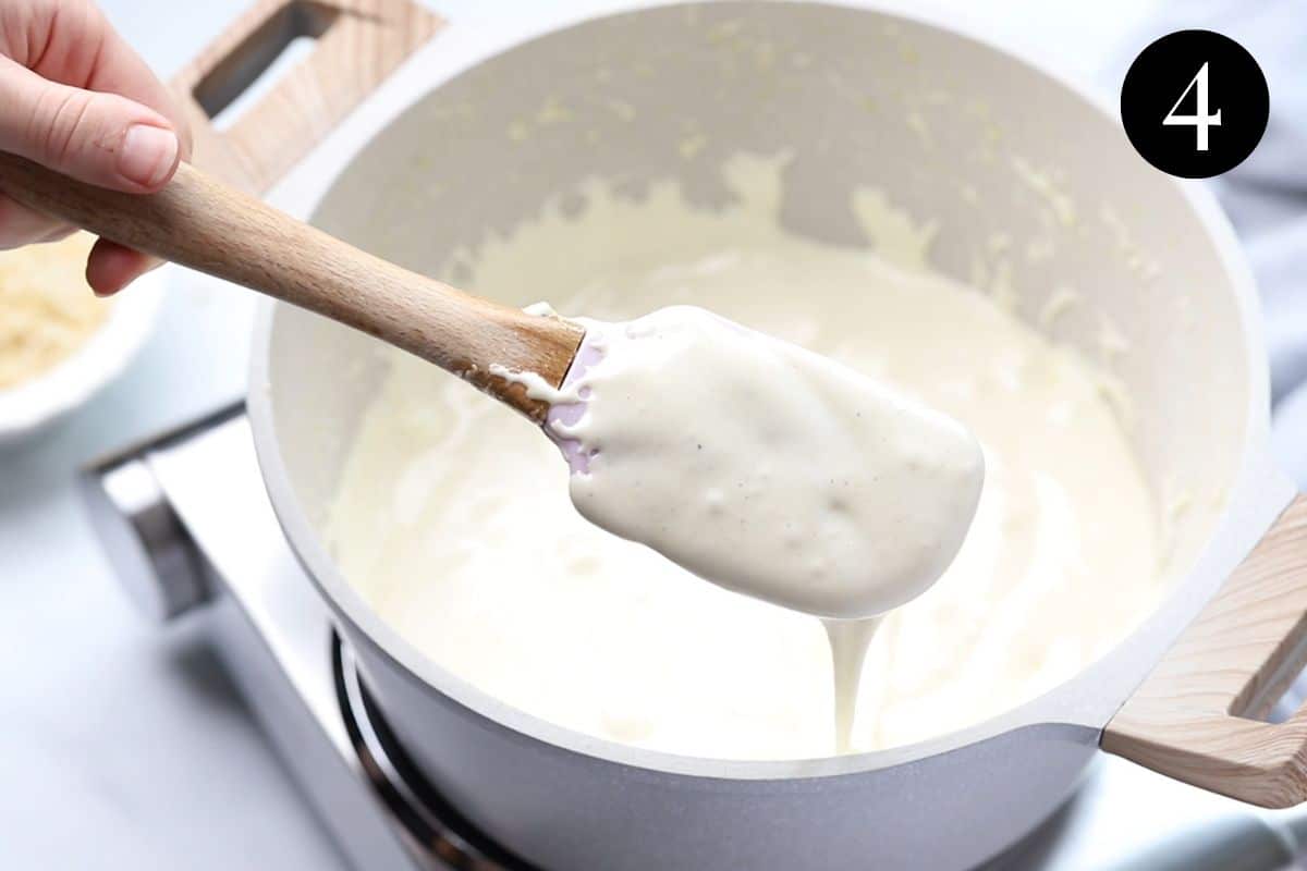 a spatula with marshmallow mixture dripping from the sides.