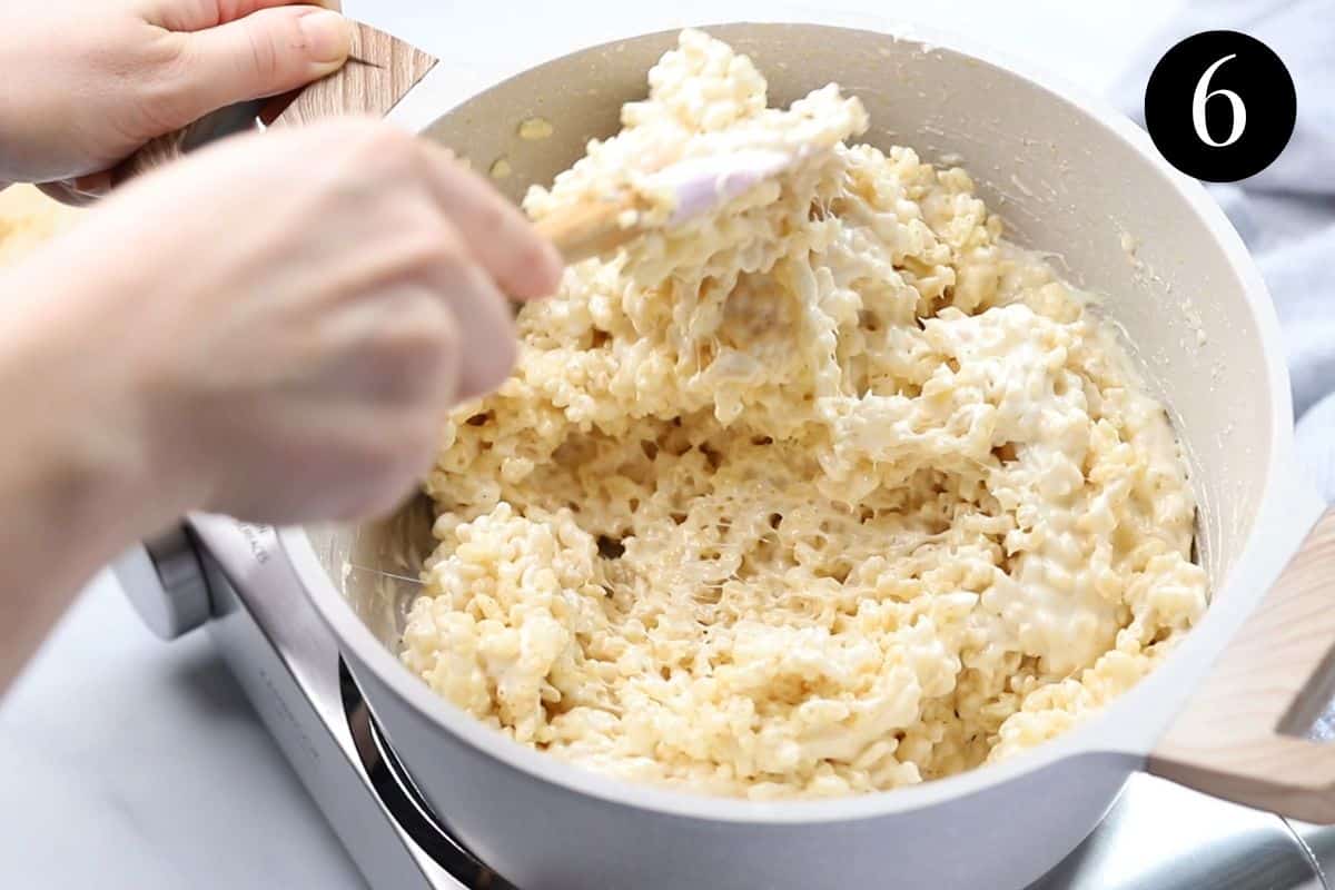 Rice Bubble mixture being stirred in a pot.