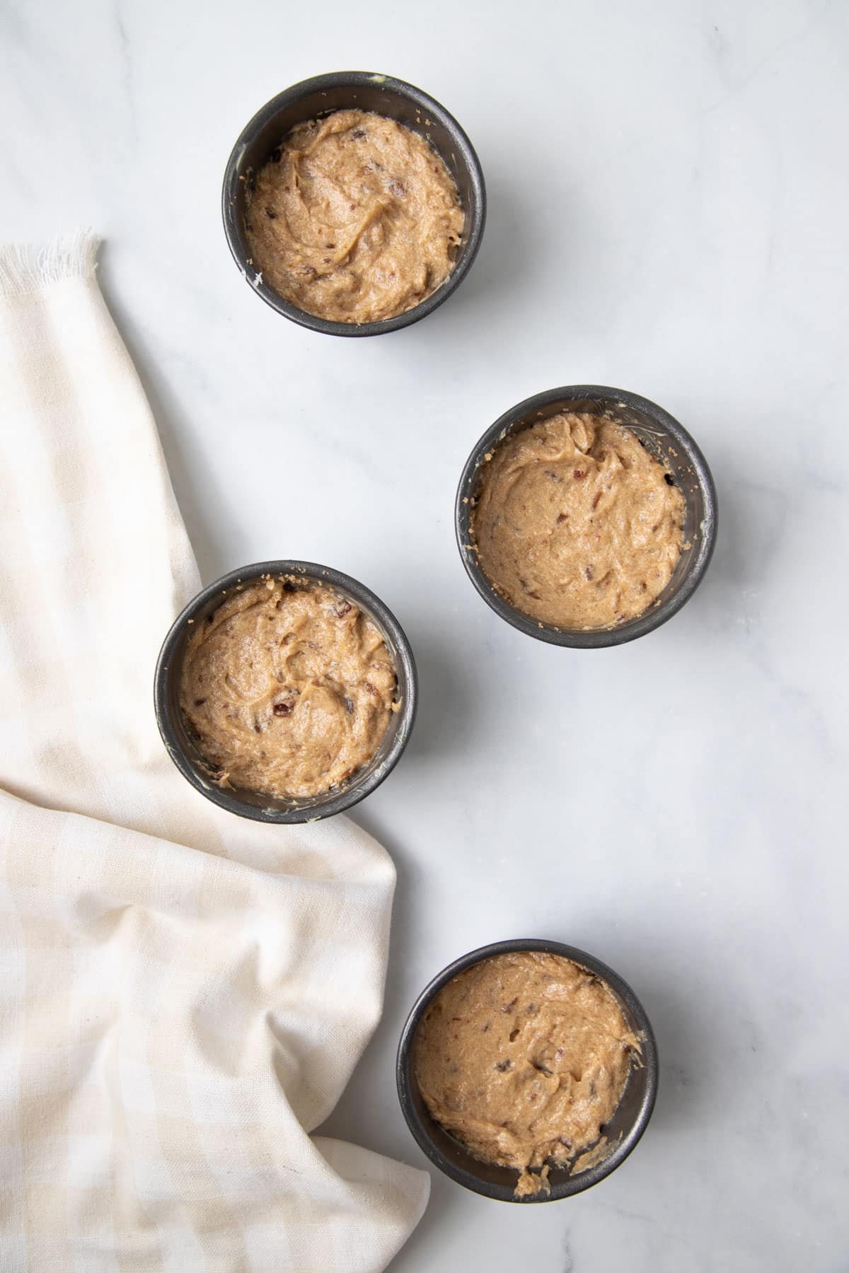 pudding moulds with cake batter.