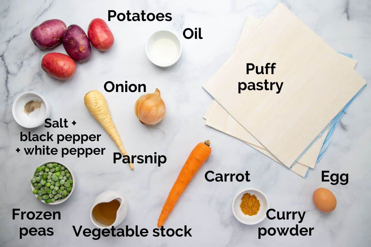 all ingredients for vegetable pasties, laid out on a table.