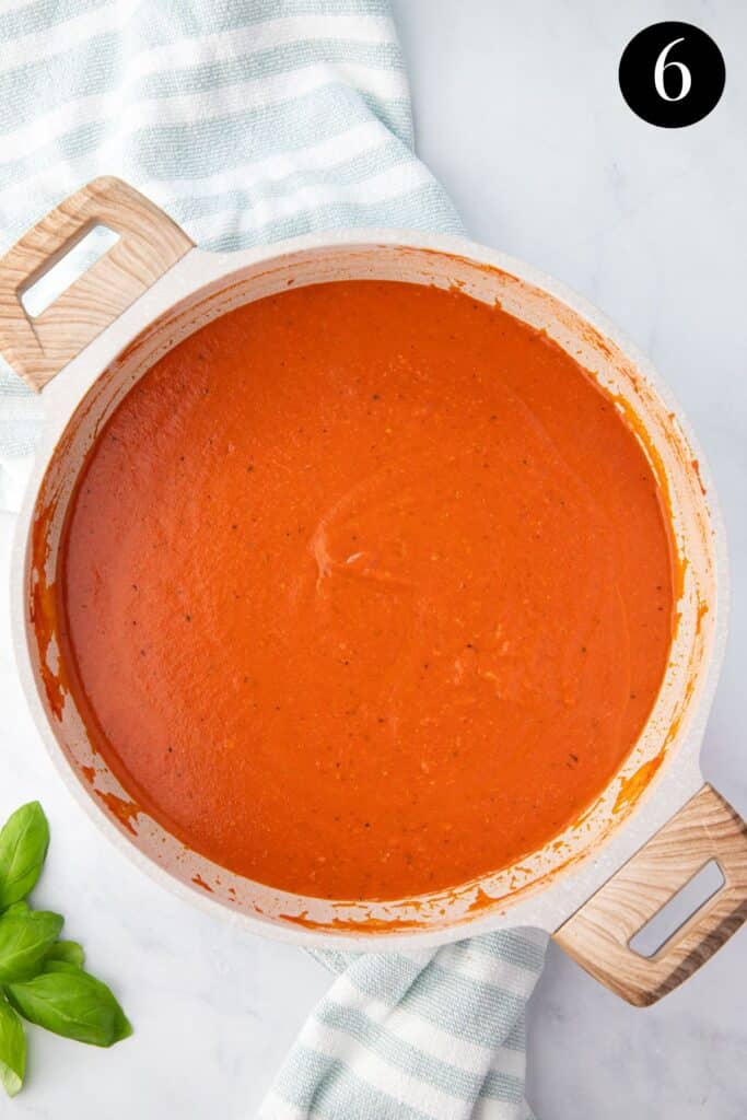 creamy tomato pasta sauce in a pot.